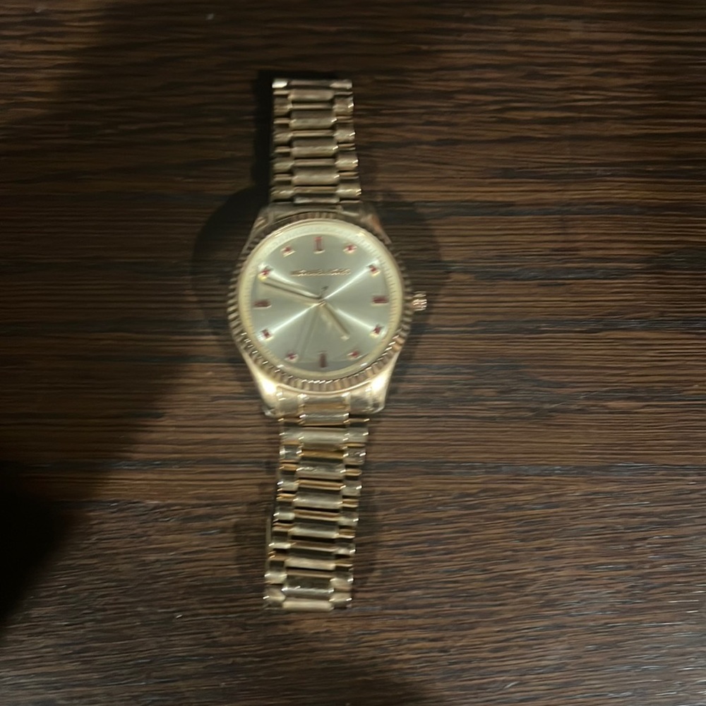 Michale Kors watch. Needs new battery. No extra links